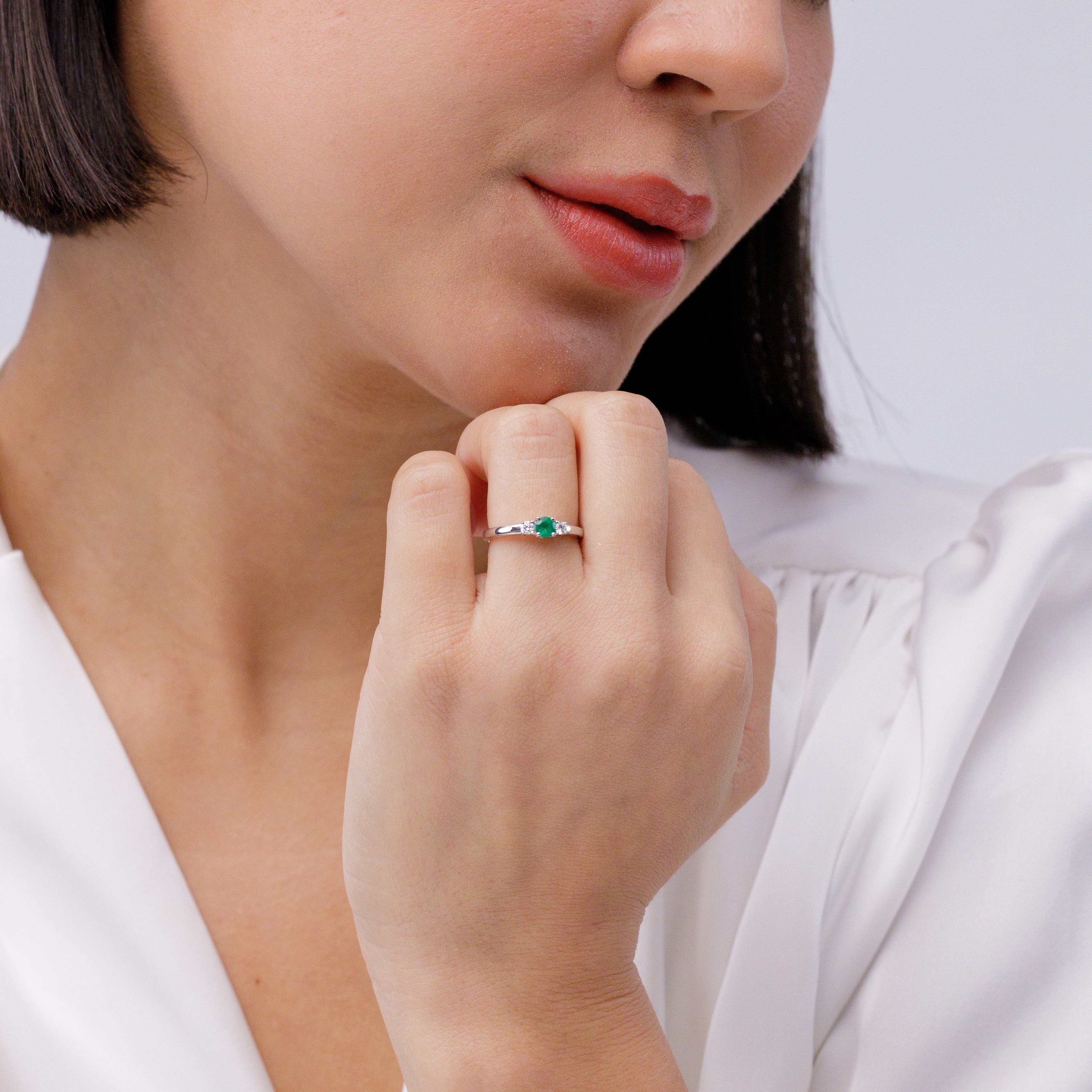 Classic Round Emerald and Diamond Three Stone Engagement Ring