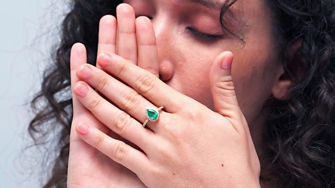 Prong-Set Pear Emerald Engagement Ring with Diamond Halo