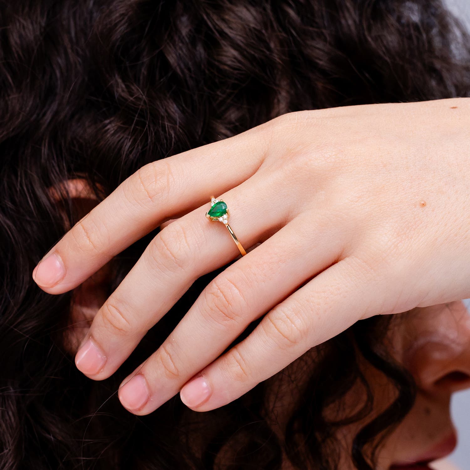 Pear Emerald Solitaire Engagement Ring with Trio Diamond Accents