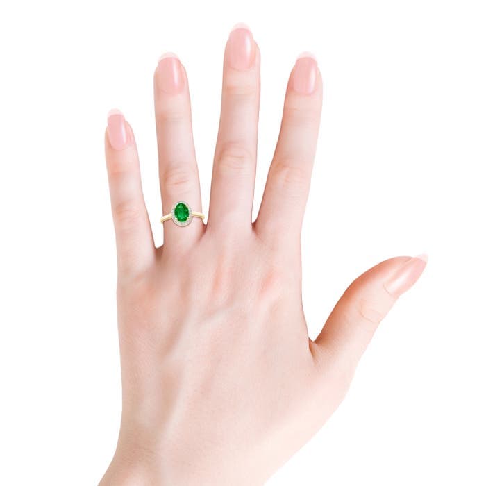 Prong-Set Oval Emerald and Diamond Halo Engagement Ring