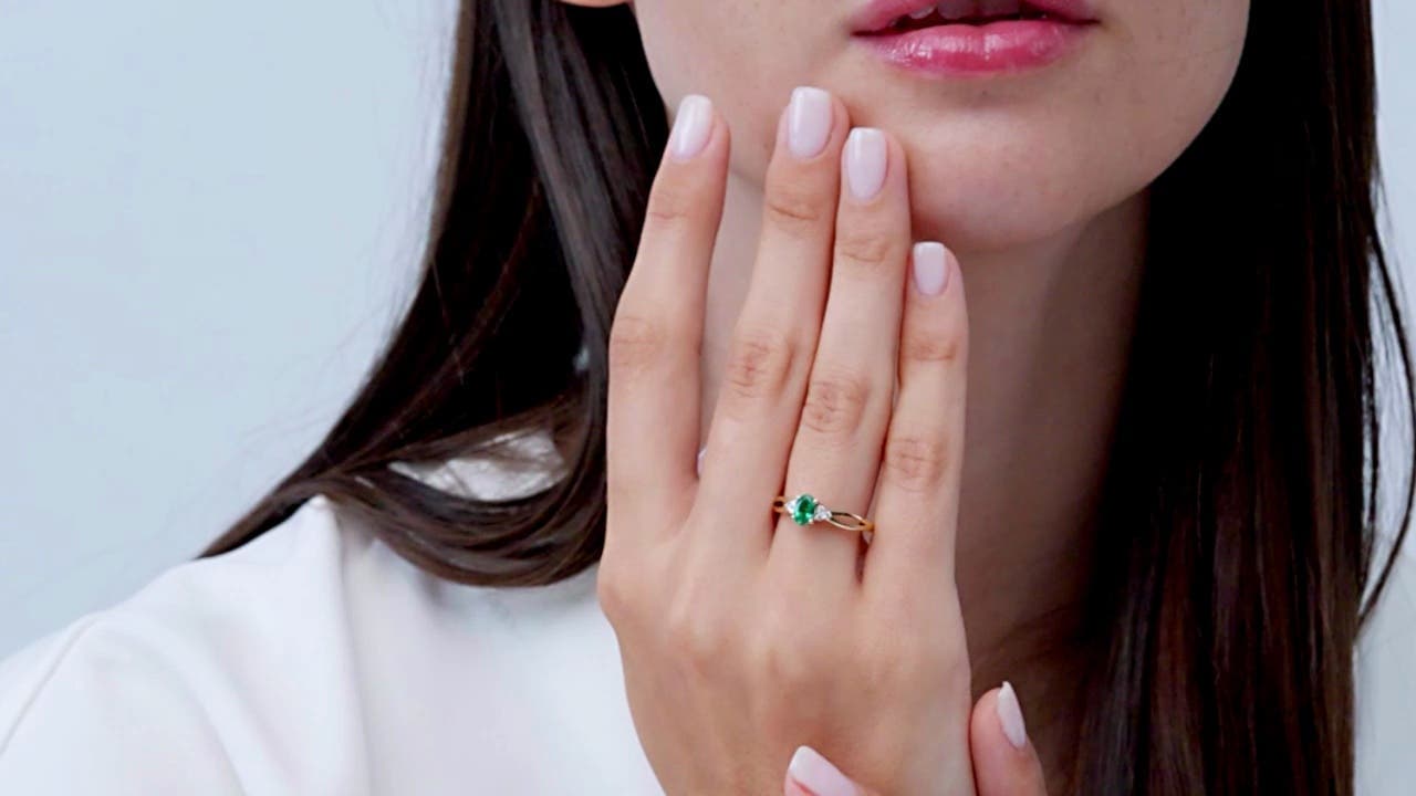 Solitaire Oval Emerald Split Shank Engagement Ring with Trio Diamonds