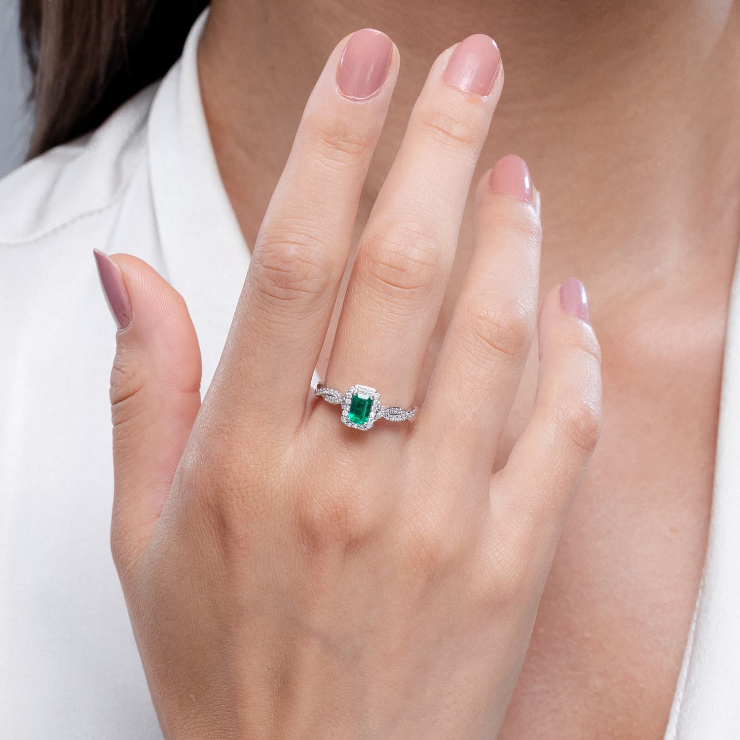Emerald-Cut Emerald Halo Twisted Shank Engagement Ring