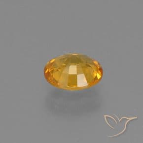 0.61ct Deep Golden Orange Sapphire, Oval Cut, 5.6x4.8 mm